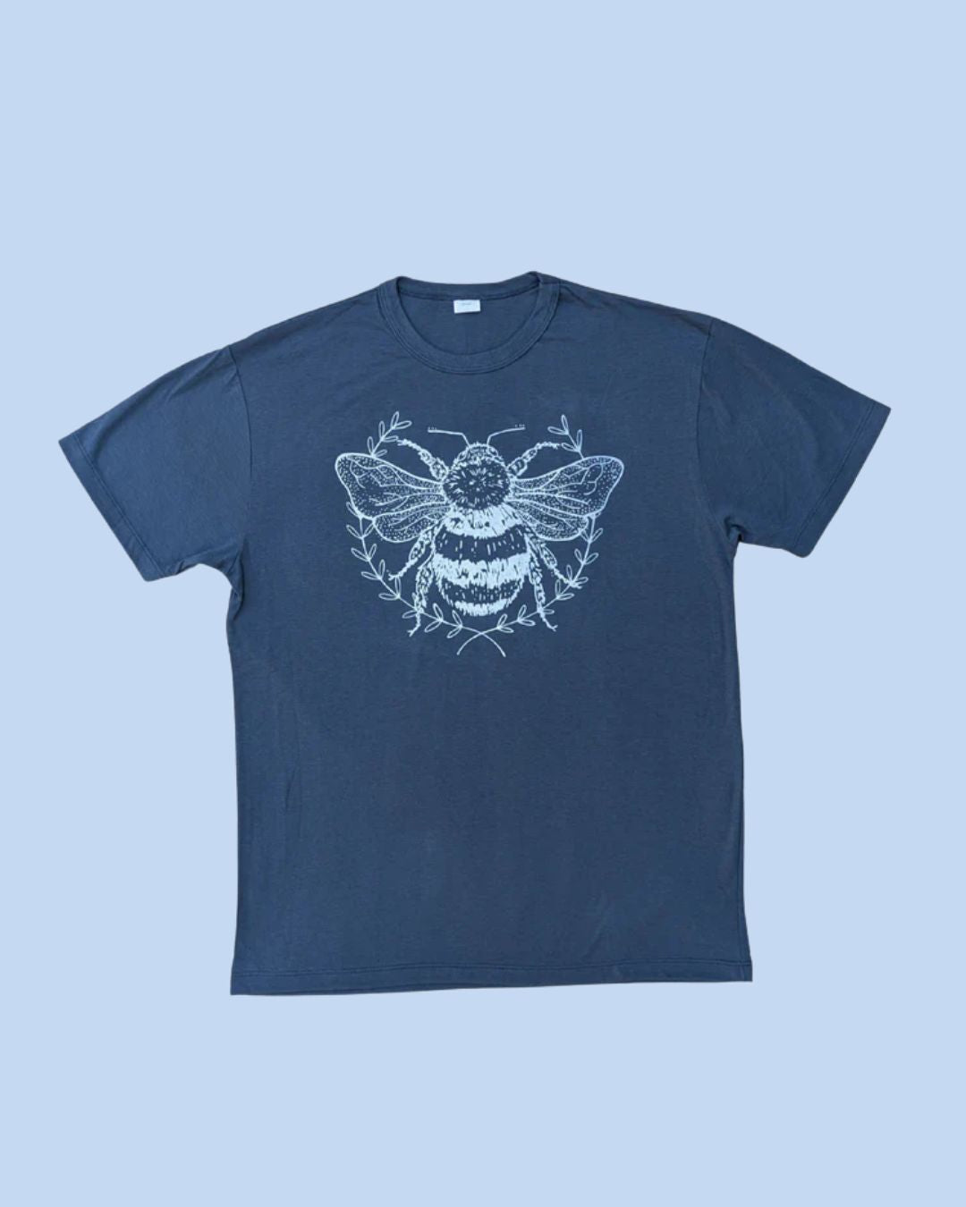 A tee shirt print with a single bee